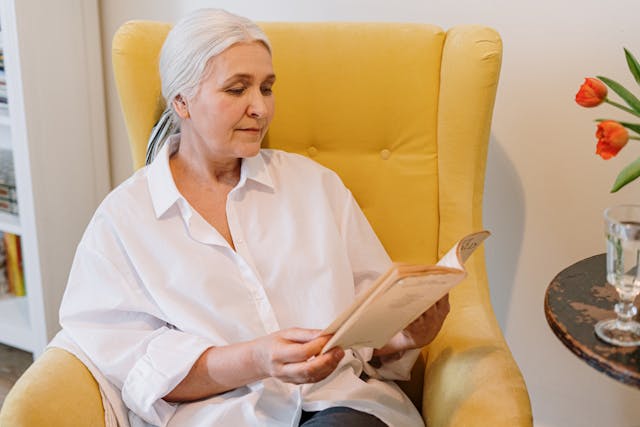 importance of incapacity planning, image of senior woman reading a book indoors