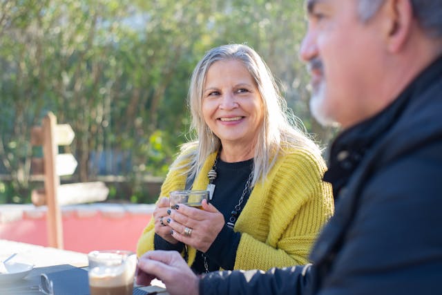 incentive trusts, image of man and woman drinking coffee outdoors