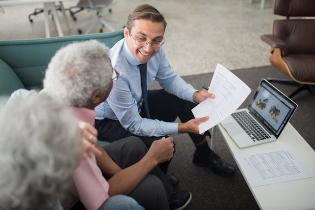 estate planning, image of senior couple meeting with a lawyer