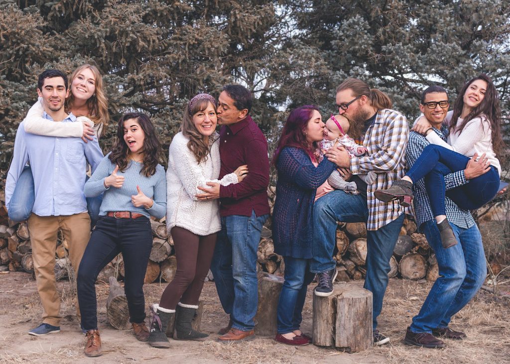 Estate Planning for Blended Families, image of large extended family posing with humor outdoors
