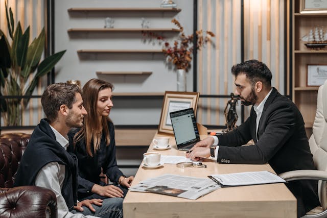 estate planning consultation, image of couple meeting with advisor