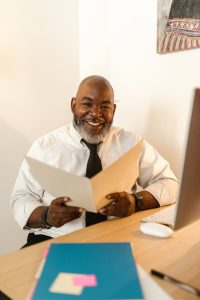 can I write my own will, image of a smiling man working in his office